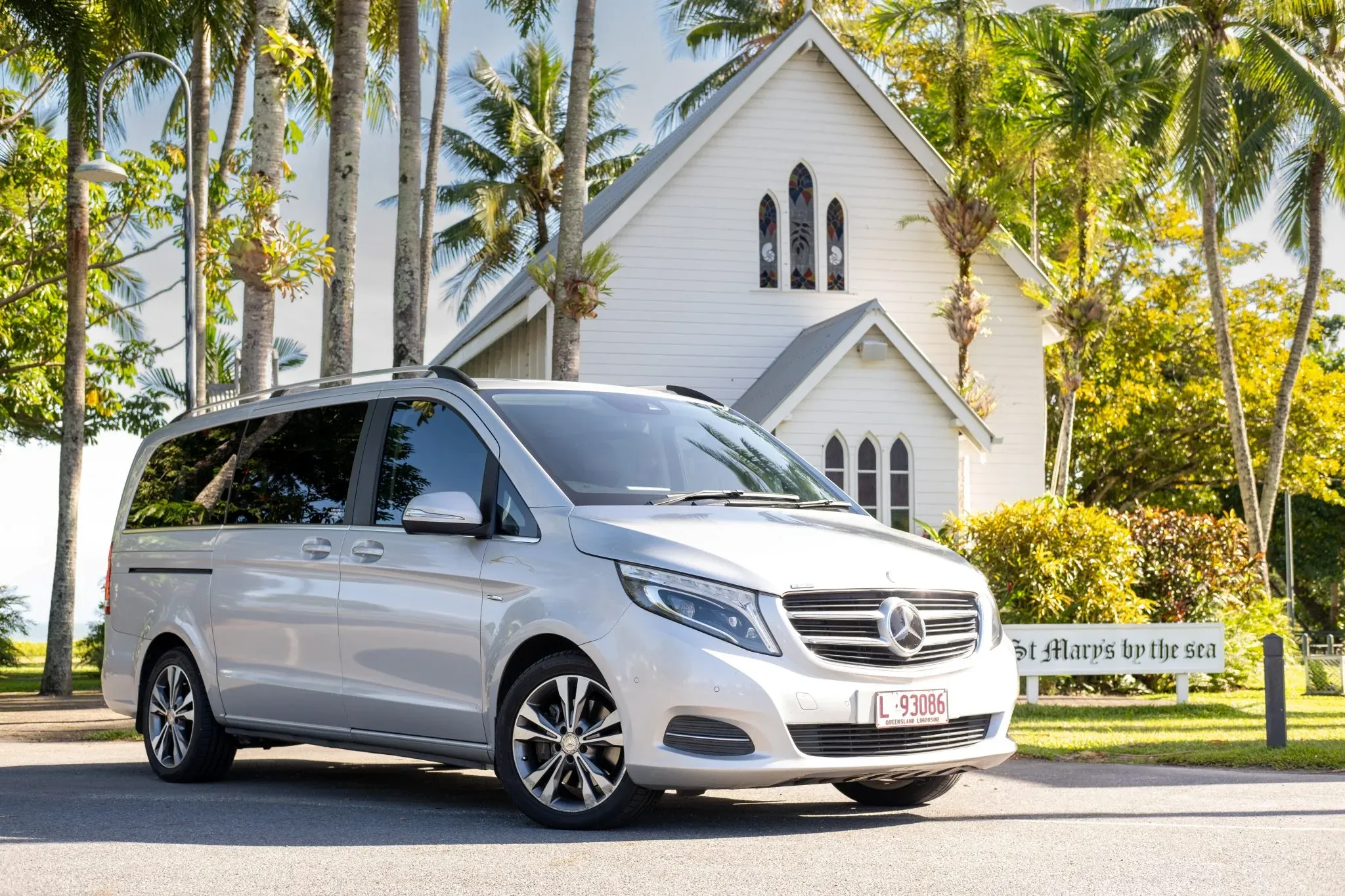 The Mercedes-Benz V-Class parked under the palms at St Mary's by the Sea, Port Douglas